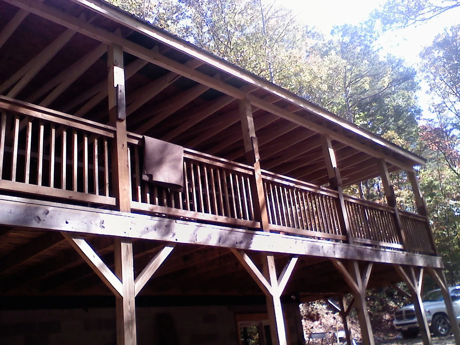 Timber framing under a new elevated porch and deck — Roof Leak Repair in South Hamilton by Roofing Brothers